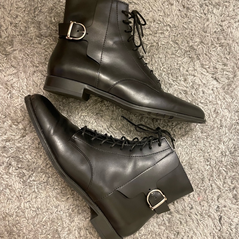TOD’S black lace-up boots.